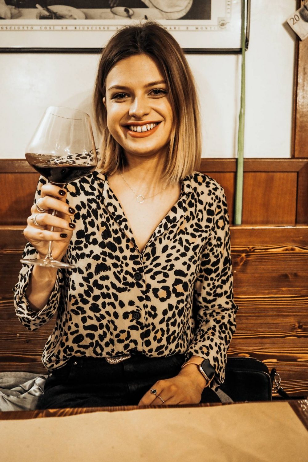 Sophie holding a glass of wine